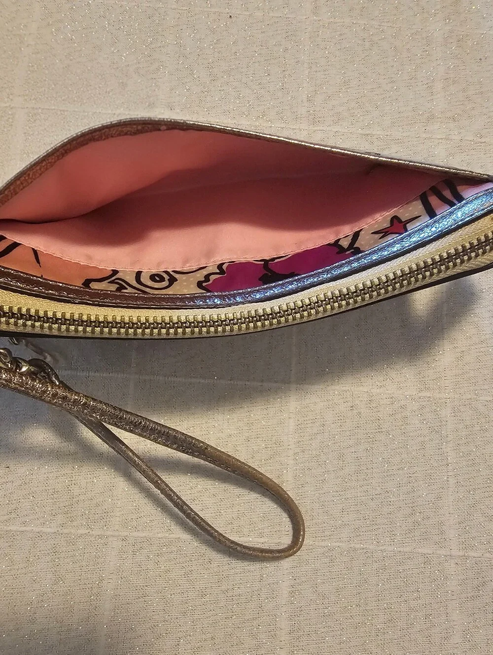 Coach Poppy pink floral graffiti print and metallic silver trim wristlet